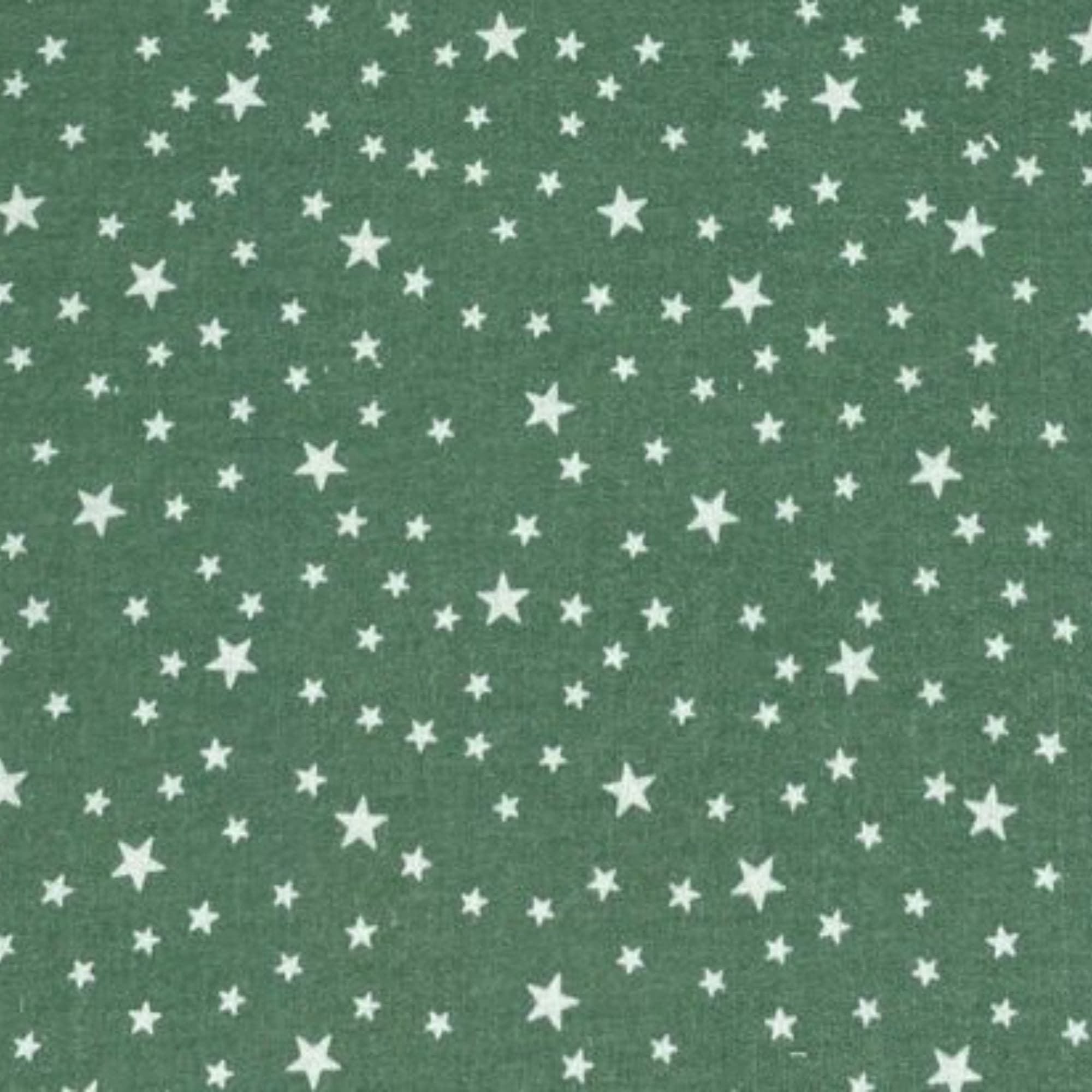 Tela algodón estampada con estrellas blancas y fondo verde — imagen 1