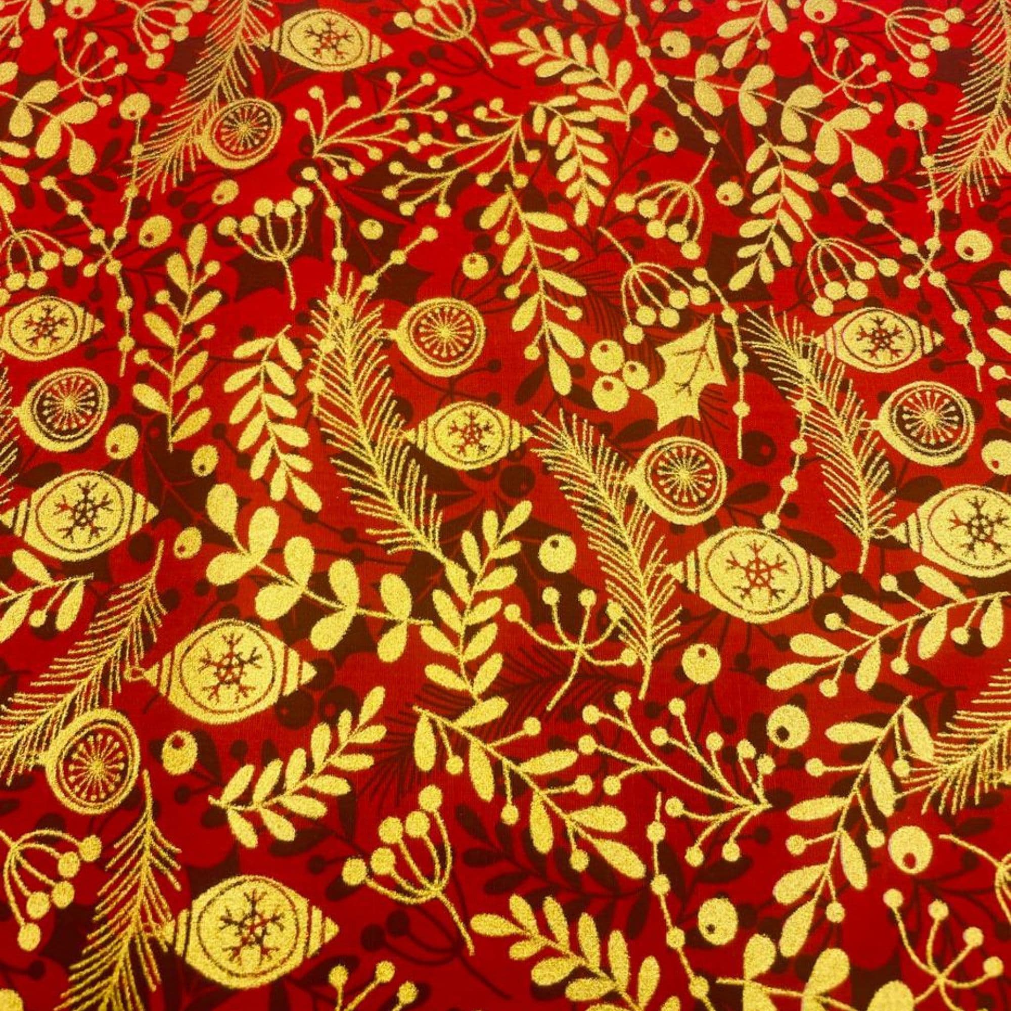 Tela algodón 100%  motivos navideños hojas variadas doradas y fondo rojo — imagen 1