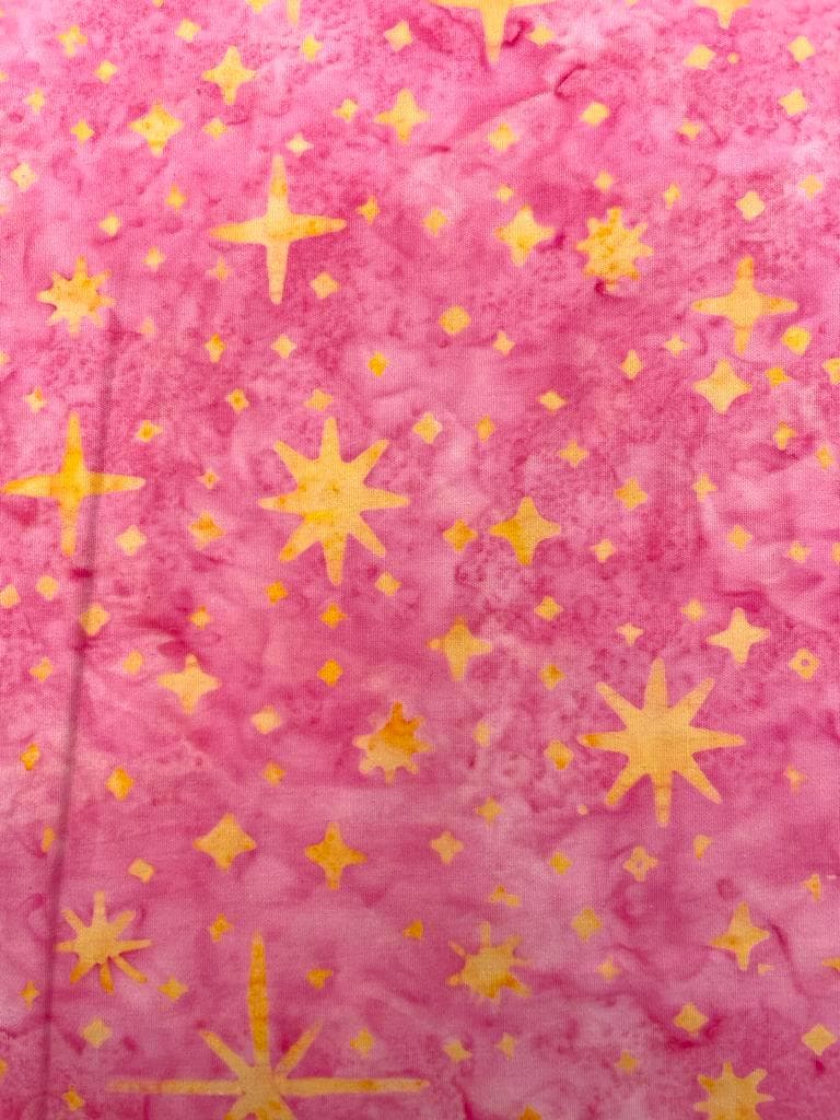 Tela batik algodón 100% fondo fucsia estrellas doradas — imagen 1