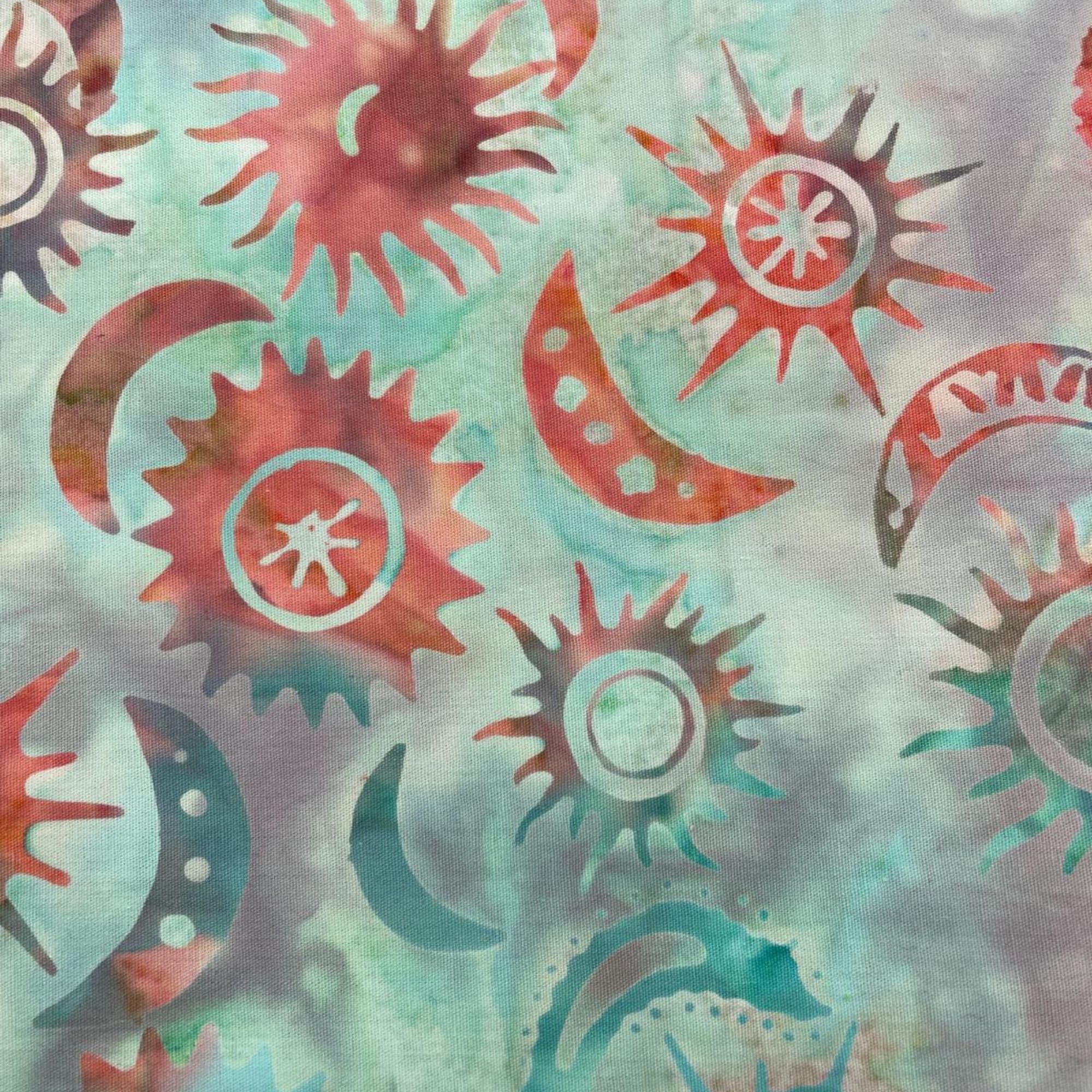 Tela batik algodón 100% soles y lunas fondo verde agua — imagen 1